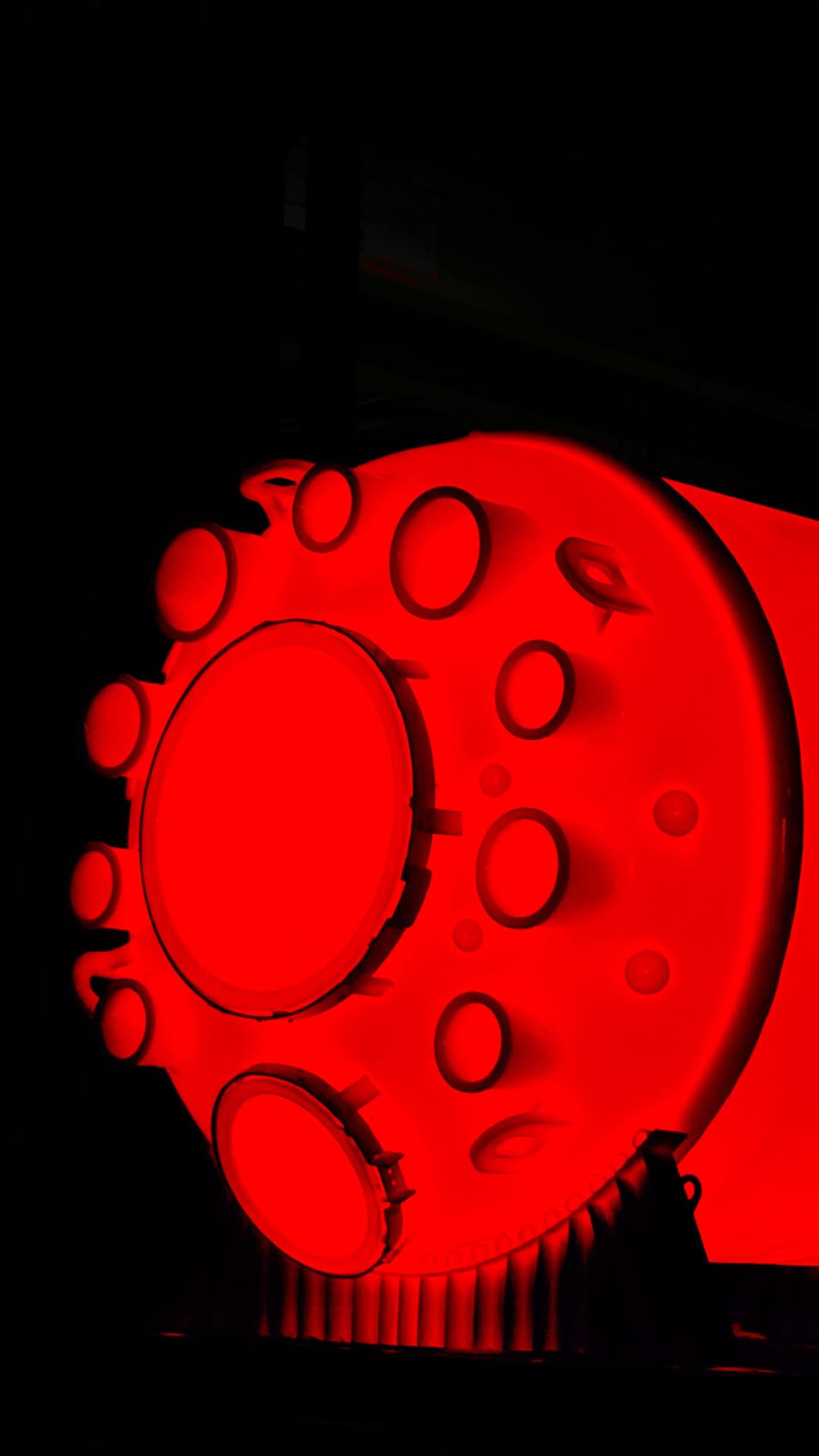 A glass lined vessel glowing red as it leaves the firing furnace at the STAHL GLAS works